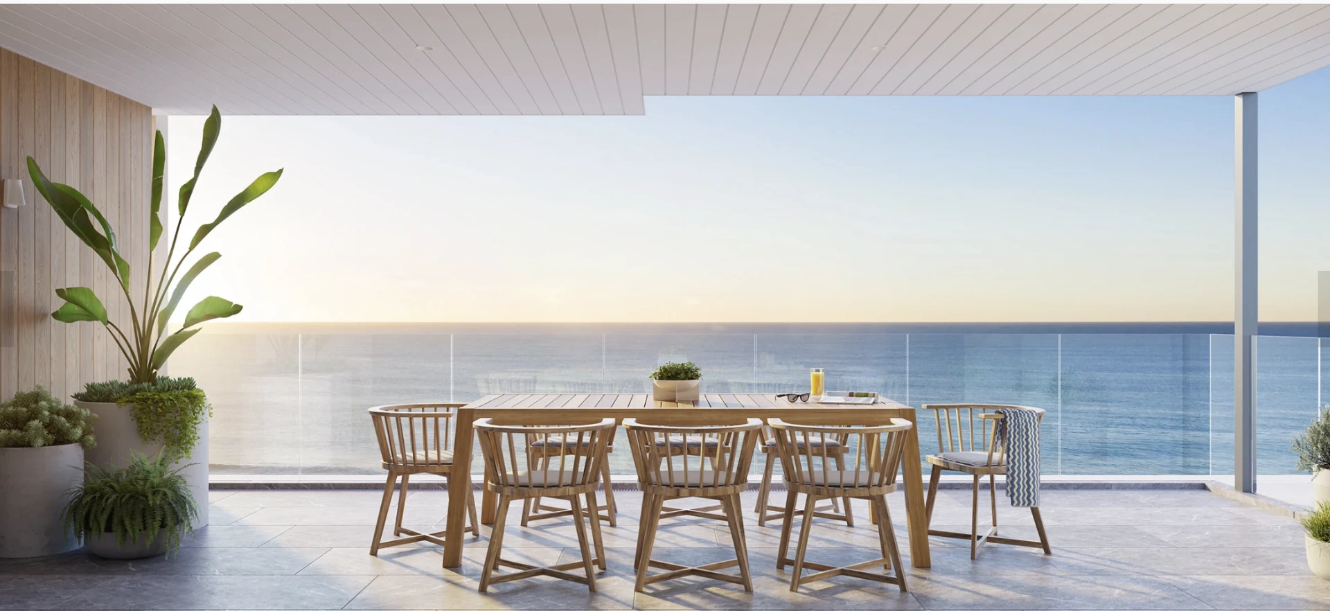 Earlier residential — Covered balcony dining with an outlook to the water
