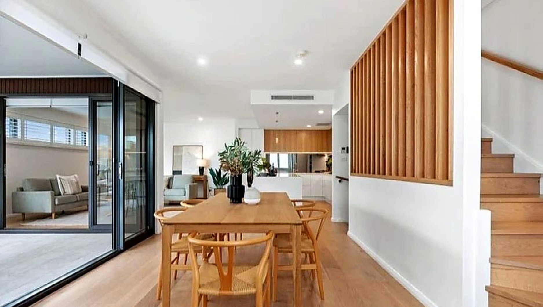 Open-plan living and dining area in a completed Dimora Projects home