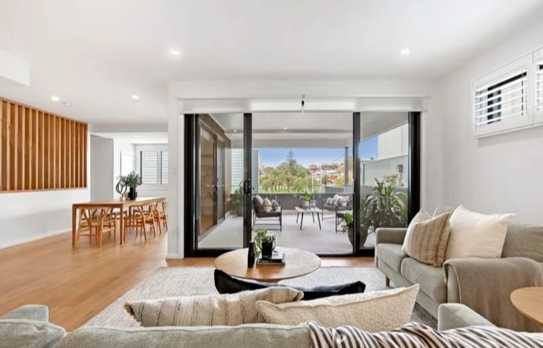 Bar Beach — Living room opening to the balcony and parkland outlook